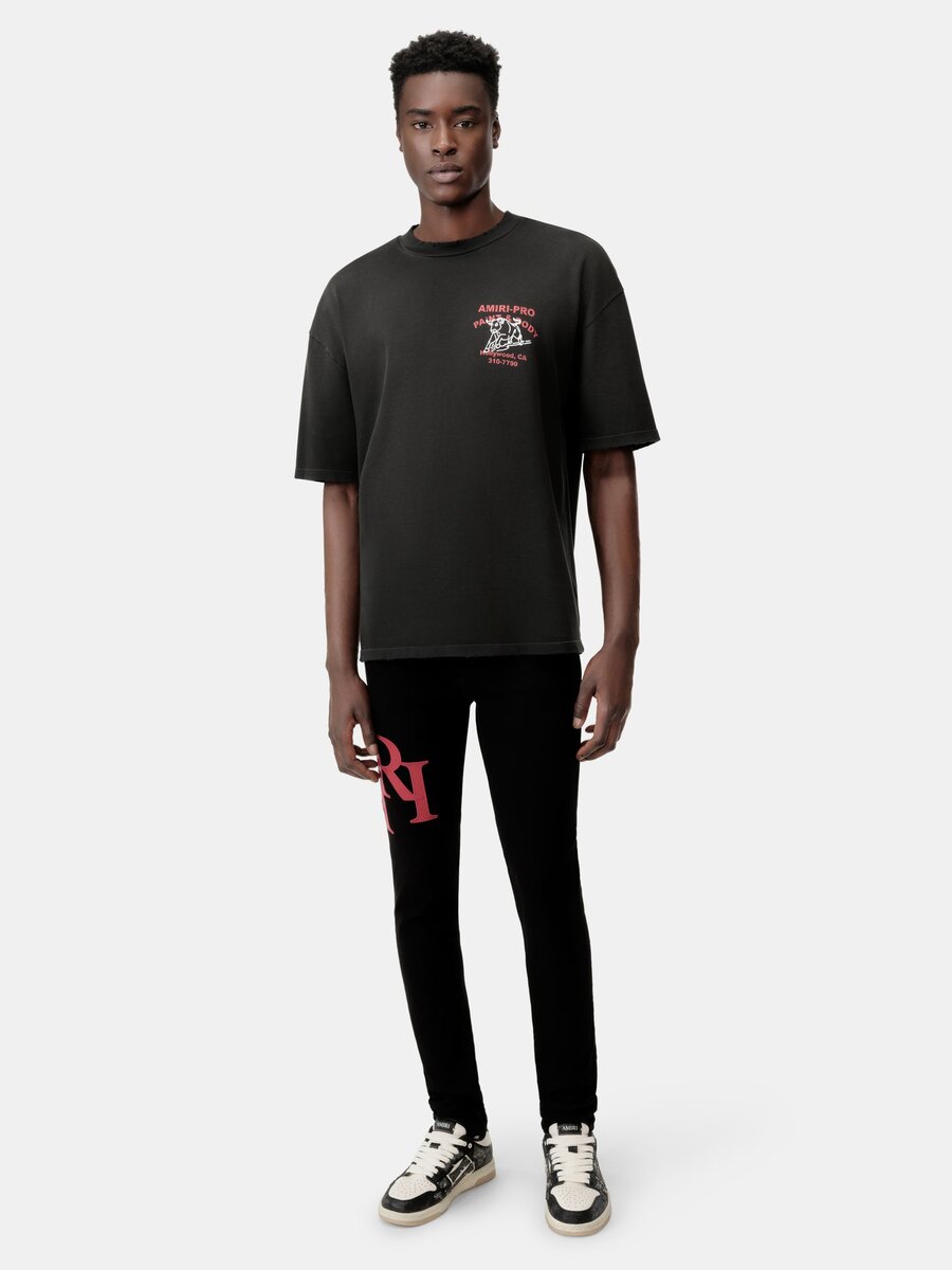 STAGGERED LOGO SKINNY JEAN- Black Red